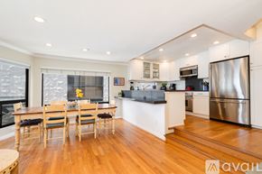 San Diego condo for rent - A kitchen with a dining table and chairs.