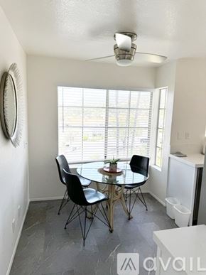 San Marcos condo for rent - A dining room with a round table and chairs.