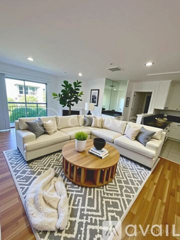 Los Angeles apartment for rent - A living room with a white couch and a coffee table.