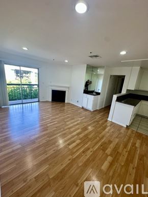 Los Angeles apartment for rent - A spacious room with wood flooring and white walls.