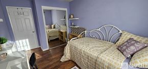 San Jose apartment for rent - A bedroom with a bed, a desk, and a mirror.