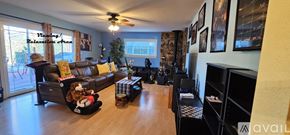 San Jose apartment for rent - A living room with a couch, chair, and a television.