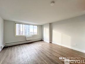 Chicago apartment for rent - A room with a window and a sign that says BEALPROPERTIES.