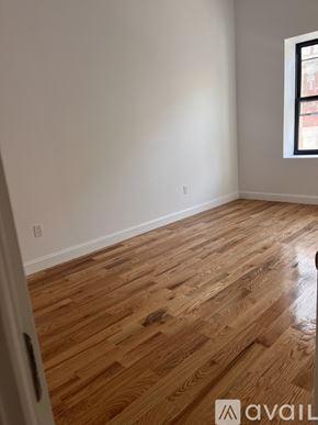 Paterson apartment for rent - A room with wooden flooring and a window.