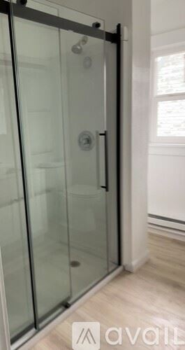 Seattle apartment for rent - A glass door with a handle is in the foreground.
