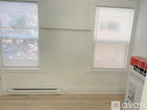 Seattle apartment for rent - A room with a window and a sign that says "Available".