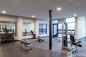 Milwaukee apartment for rent - A gym with a variety of equipment including weights and machines.