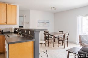 Milwaukee apartment for rent - A kitchen with a dining table and chairs.