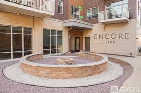 Milwaukee apartment for rent - A building with the word "ENCORE" on it and the number "1623" below it.