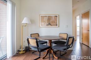 Milwaukee apartment for rent - A dining room with a round table and chairs.