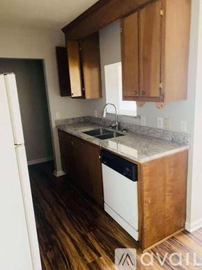 Greenville apartment for rent - A room with a ceiling fan and a door.