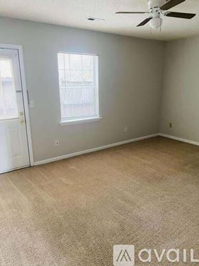 Greenville apartment for rent - A bathroom with a toilet, sink, and bathtub.