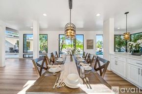 Palm Desert house for rent - A dining room with a long table set for a meal.