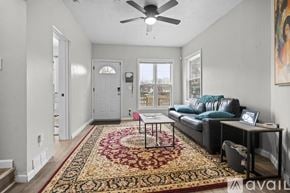 Cleveland house for rent - A kitchen with white cabinets and a stainless steel oven.