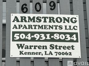 Kenner apartment for rent - A sign for Armstrong Apartments LLC is displayed on a building.