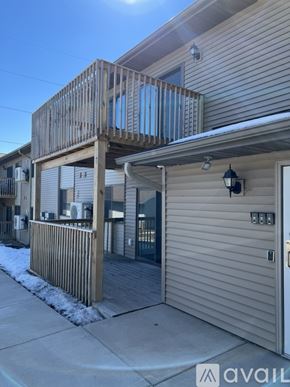 Galesville apartment for rent - A building with a balcony and a garage door.