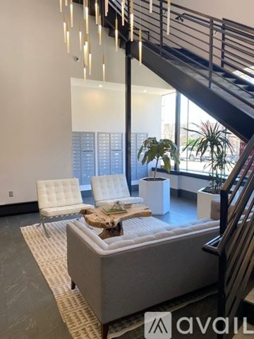 Lawrence apartment for rent - A living room with a couch, chairs, and a coffee table.