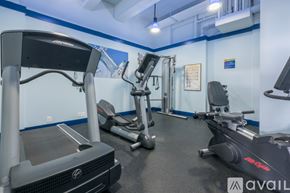 Washington apartment for rent - A gym with treadmills, elliptical machines, and other exercise equipment.