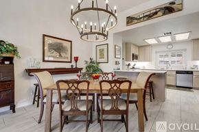 La Quinta house for rent - A dining room with a wooden table and chairs.
