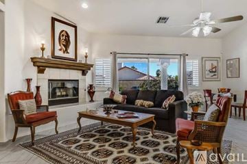 La Quinta house for rent - A living room with a fireplace and a painting on the wall.
