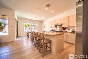 La Quinta house for rent - A kitchen with a table and chairs is available for rent.