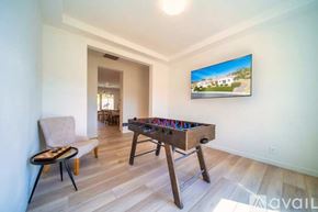La Quinta house for rent - A room with a pool table and a chair.