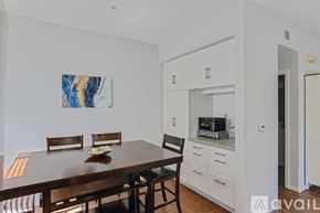 San Diego townhouse for rent - A dining room with a wooden table and chairs.