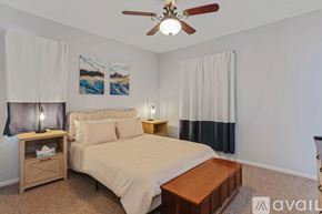 San Diego townhouse for rent - A bedroom with a bed, nightstand, and a ceiling fan.