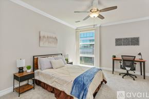 San Diego condo for rent - A bedroom with a bed, desk, and chair.