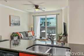 San Diego condo for rent - A modern kitchen with a stainless steel sink and a ceiling fan.