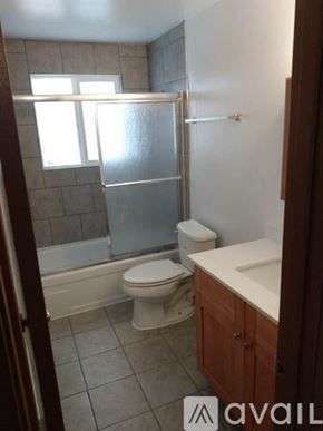Lynnwood apartment for rent - A bathroom with a toilet, sink, and shower.