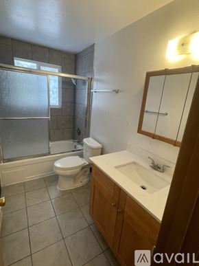 Lynnwood apartment for rent - A bathroom with a toilet, sink, and shower.