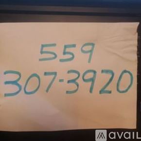 Tollhouse townhouse for rent - A white sign with the numbers 559 and 307-3920 written in blue.