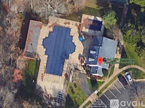 Clifton townhouse for rent - An aerial view of a community pool surrounded by buildings and trees.