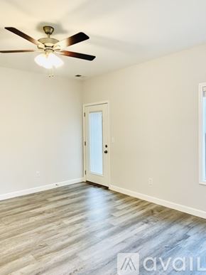 Bowling Green apartment for rent - A room with a ceiling fan and a door.