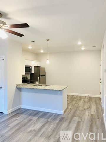 Bowling Green apartment for rent - A kitchen area with a counter and a fan on the ceiling.