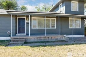 Lawton house for rent - A house with a blue door and white trim.