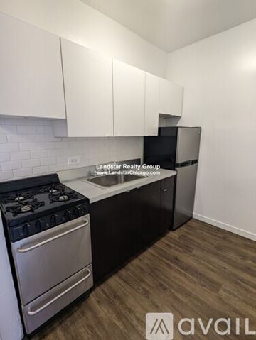 Chicago apartment for rent - A kitchen with a stove and a refrigerator.