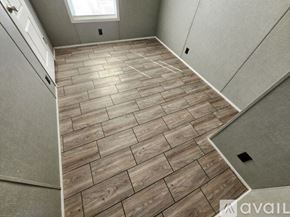 Stilwell apartment for rent - A wooden floor in a room with a skylight.
