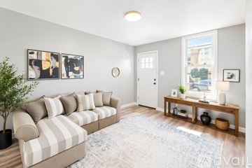 Pittsburgh house for rent - A kitchen with a stove, oven, refrigerator, and microwave.