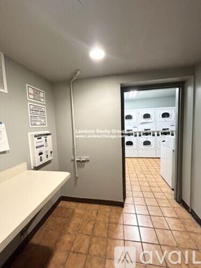 Chicago apartment for rent - A laundry room with a washer and dryer.
