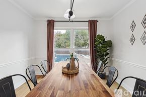 North Richland Hills house for rent - A dining room with a wooden table and chairs.