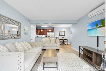 San Diego condo for rent - A living room with a white sofa and a wooden coffee table.