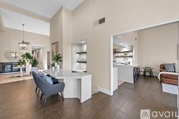 La Quinta house for rent - A modern living room with a grey sofa and a white coffee table.