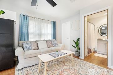 West Palm Beach apartment for rent - A living room with a white couch and a rug.