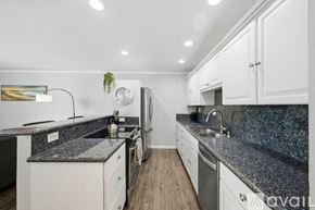 San Diego condo for rent - A dining room with a wooden table and chairs.