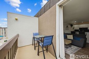 San Diego condo for rent - A bedroom with a bed, two lamps, and pictures on the wall.