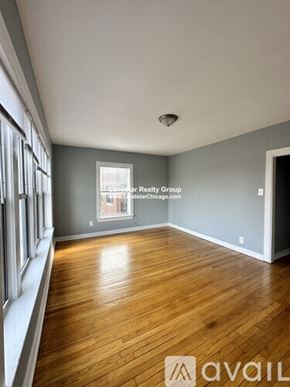 Chicago apartment for rent - A room with wooden flooring and a window.