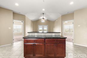 College Station apartment for rent - A kitchen with a large island in the middle of the room.