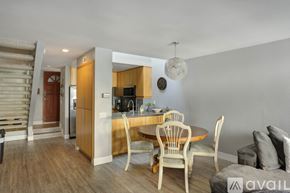 San Diego townhouse for rent - A kitchen with a dining table and chairs is available for rent.